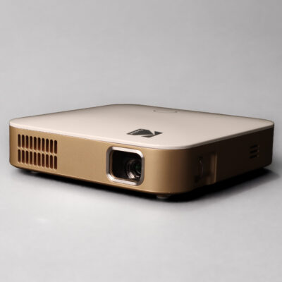 Luma 350 Gold and white Kodak Luma 350 portable projector, viewed from the front and side.